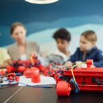 Group of kids working on robotics project, engaging in STEM education.